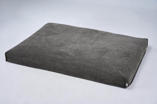 AirNest dog bed cushion in medium gray fabric with corner ties