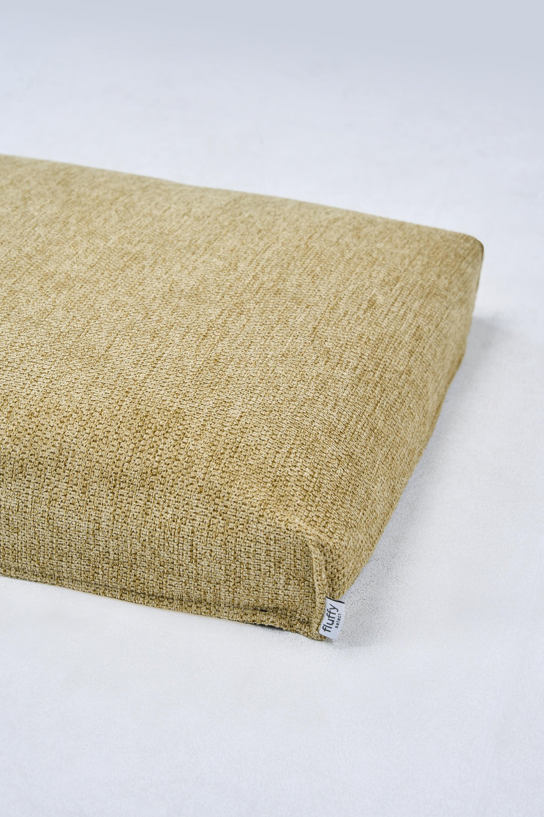 AirNest dog bed in lemongrass woven fabric, bolster corner view