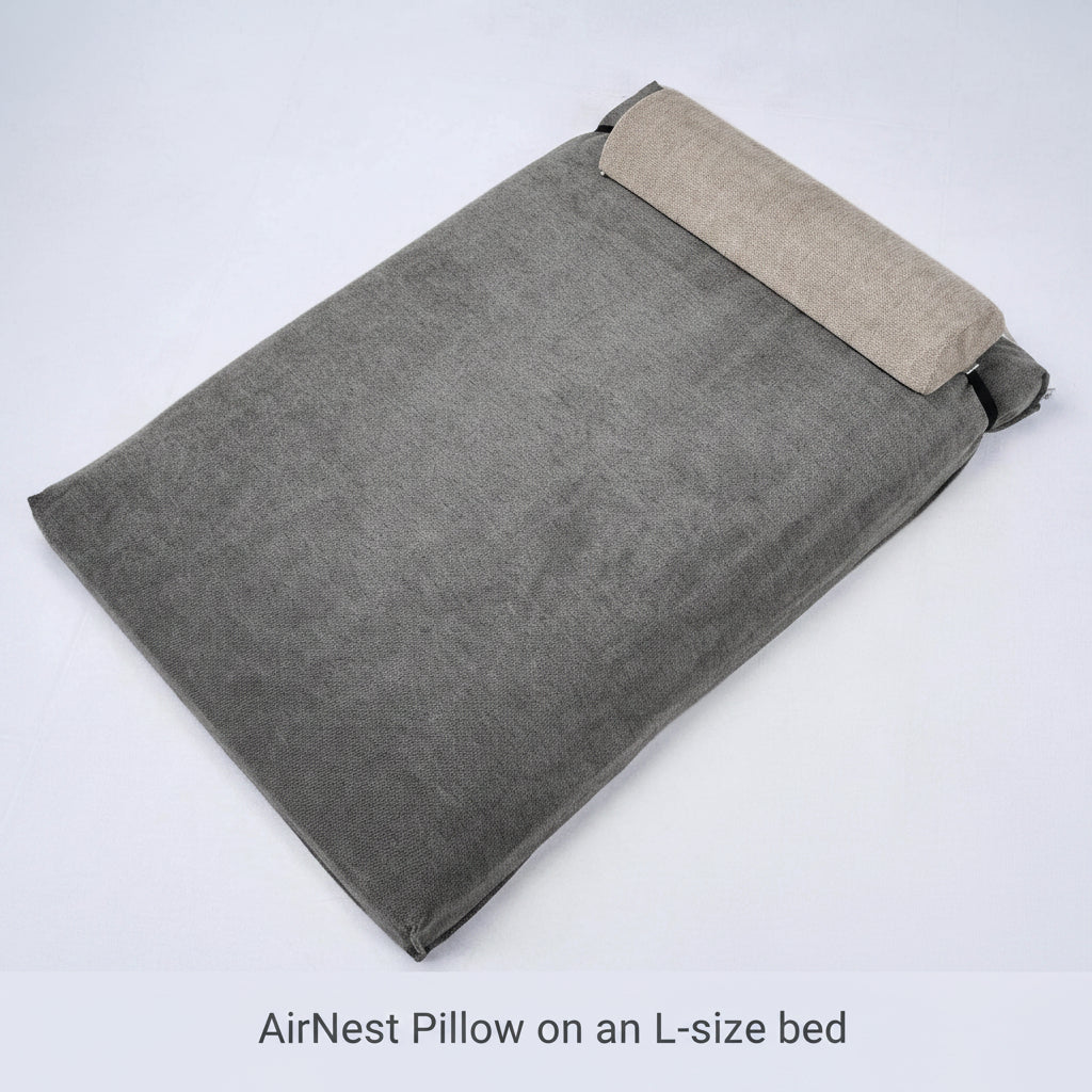 AirNest pillow with anthracite-gray cover and light gray top panel, side view