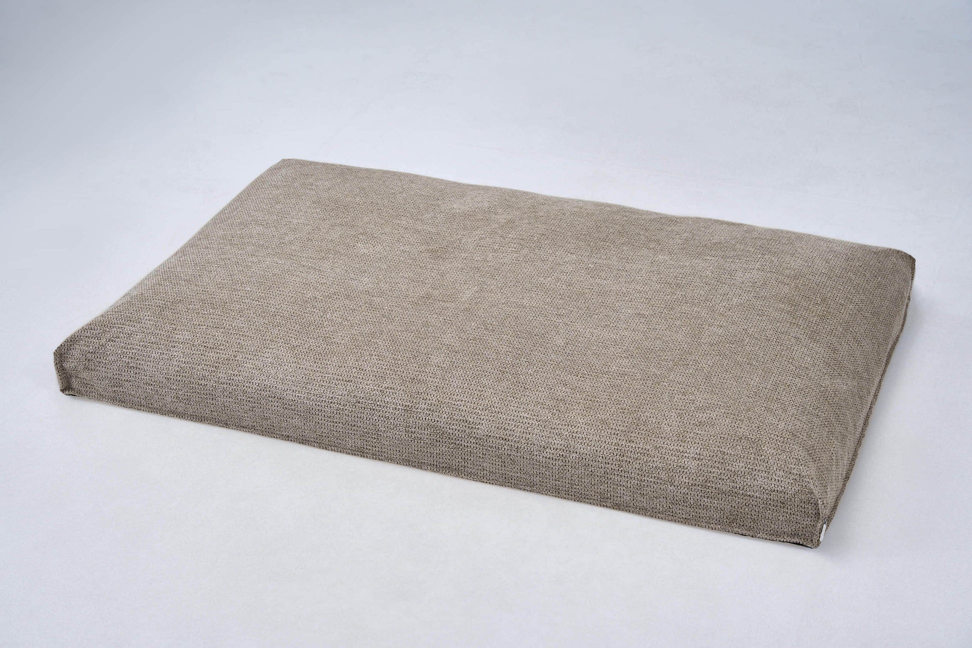 Dog bed cushion in light beige fabric with squared corners