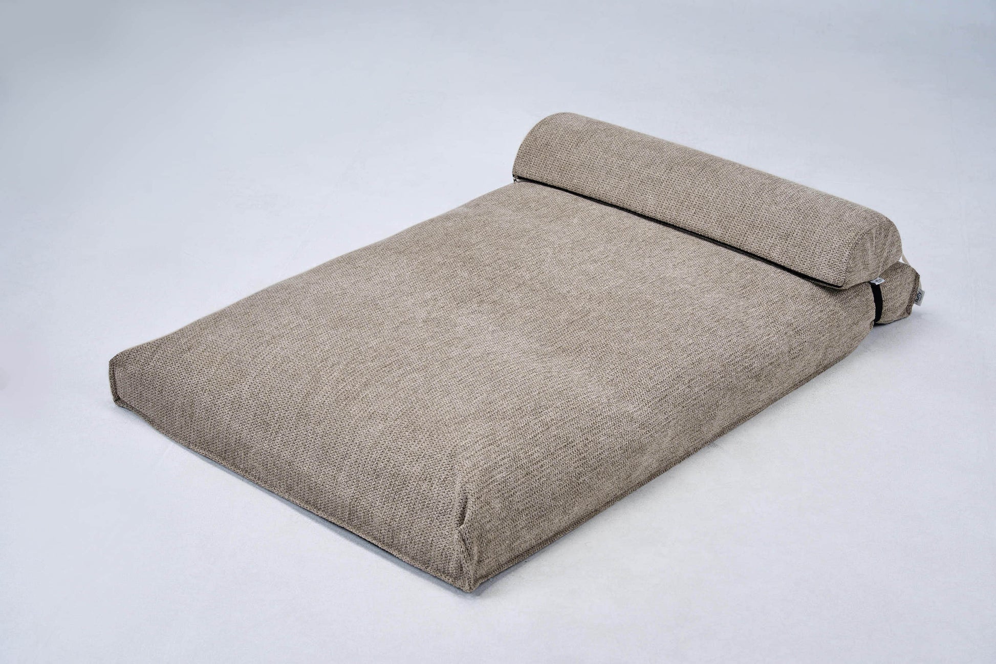 AirNest S dog bed, beige cushion with roll-up bolster and side handle